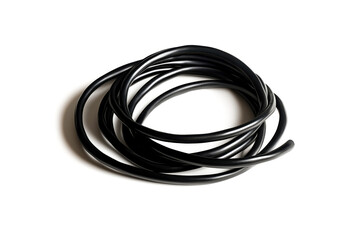 Black rubber cord coiled elegantly on a white isolated background.