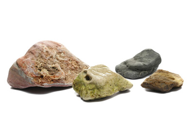 Colorful beach stones isolated on white background, side view