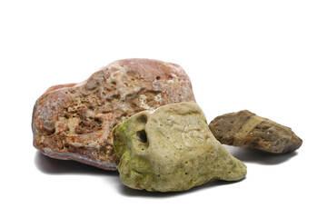 Colorful beach stones isolated on white background, side view