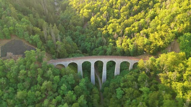 Discover the majestic Zampach railway bridge, the highest stone bridge in Czechia, surrounded by lush green forests and breathtaking landscapes. A true engineering marvel awaits your visit.