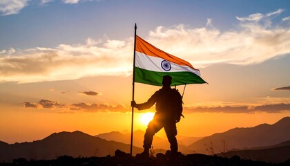 Silhouette of a person holding Indian flag at sunset