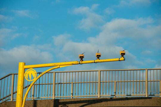 Speed cameras on a motorway  on yellow gantry capturing speeding motorists