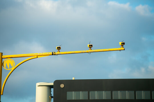 Police speed cameras on a motorway  on yellow gantry capturing speeding motorists
