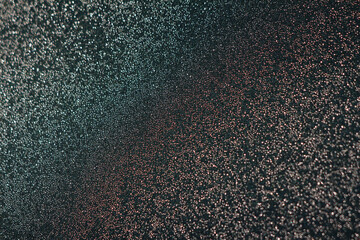 Thousands of tiny water droplets cover a dark surface, creating a sparkling bokeh effect with soft...