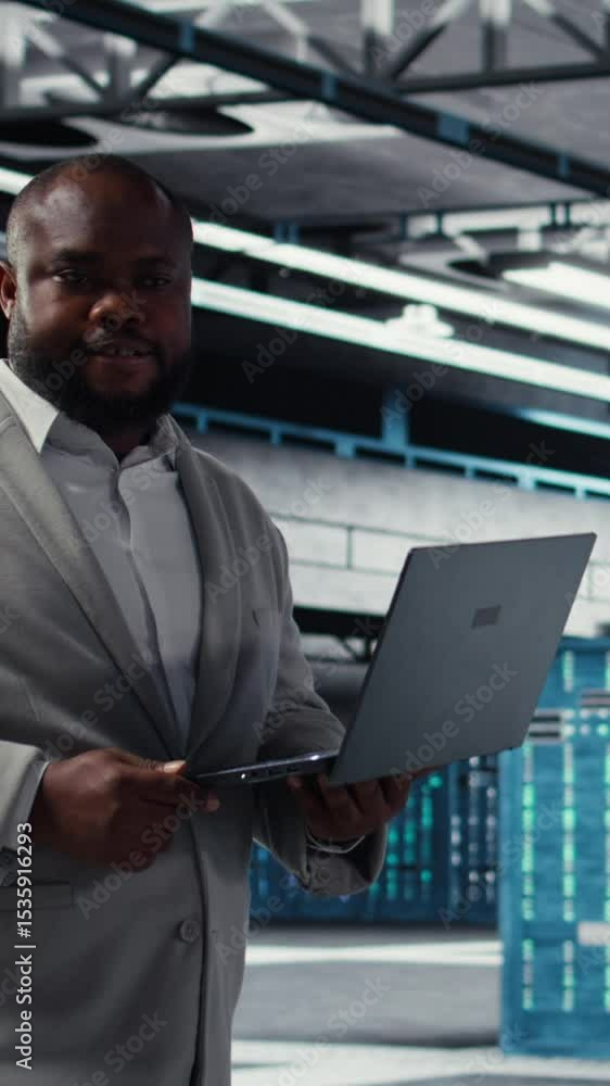 Poster vertical video cheerful data center system administrator reviews code for automation scripts. jolly 