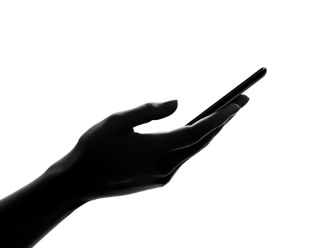 A close-up of a human hand, elegantly reaching for a smartphone against a stark black background.