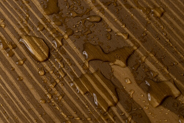 Water droplets on wood surface create rustic natural texture