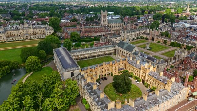 Aerial view of Cambridge University, showcasing its historic buildings, green courtyards, and the River Cam winding through the campus