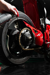 Motorcycle Chain Lubrication with Oil. Oiling motorcycle chain helps reduce wear, prevent rust, and...