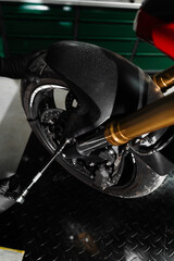 Fork maintenance improves shock absorption, control, and ride stability on the road. Mechanic...