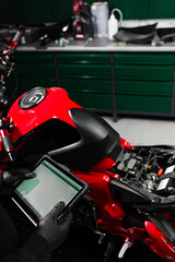 Motorcycle system diagnostic, scanning for faults across engine, electrical, and sensor modules to...
