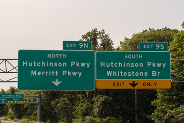 Exit signs in Harrison, New York off I-287 for 9N toward Hutchinson Parkway North and Merritt...