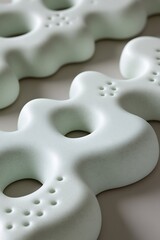Abstract Shapes in Serene Mint Green Hues with Porous Surface Details