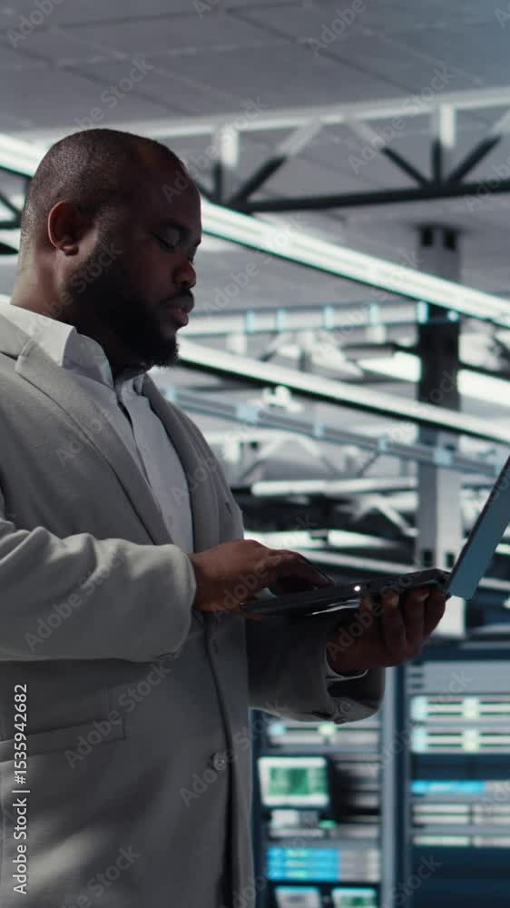 Poster vertical video smiling data center technician installing and upgrading hardware components. happy se