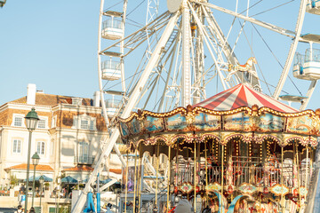 Families enjoy the cheerful atmosphere at the Cascais Christmas market, filled with colorful...