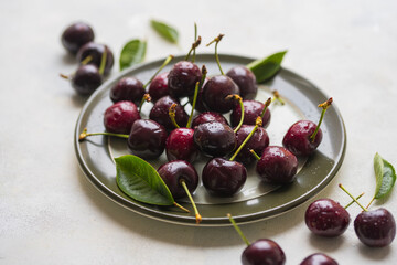 Fresh cherries fruits in a plate, top view, summer fruits. Abstract fruit food photo