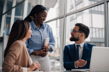Business team discussing strategy during meeting in modern office
