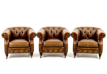 Three brown leather chesterfields isolated on white background