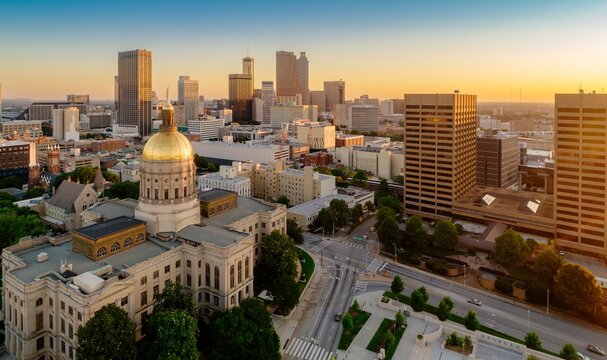 Sunset aerial view of the Georgia State Capitol building and the city skyline of Atlanta, Georgia, USA.