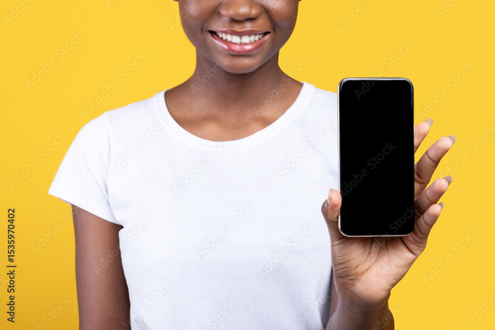 Aufkleber unrecognizable black woman showing mobile phone empty screen to camera recommending application for 