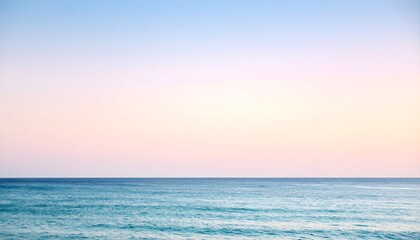 Fototapeta premium Ocean horizon with gradient pastel sky, minimalist seascape, calm and empty composition.