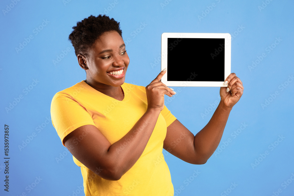 Poster smiling african american woman showing digital tablet blank screen advertising application or websit