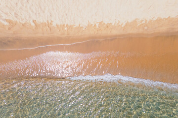 Ocean waves and beach aerial view, natural background.