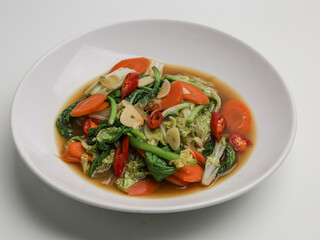 Stir fries vegetables on white plate
