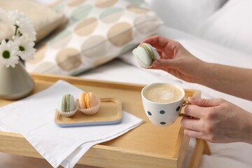 Woman having delicious breakfast in bed, closeup