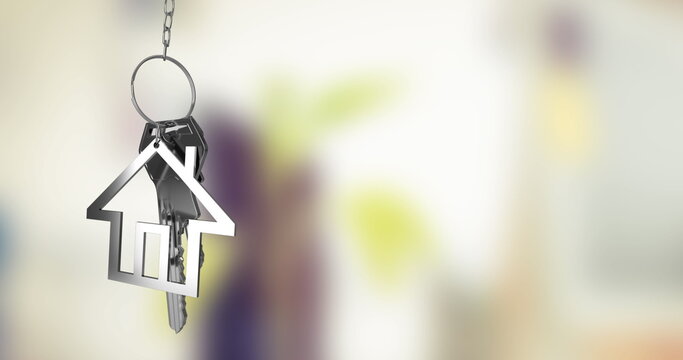 Hanging metallic house-shaped keychain pendant dangling from chain in entryway, keys, copy space