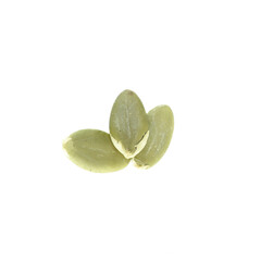 Top view of three peeled pumpkin seeds isolated on white background.