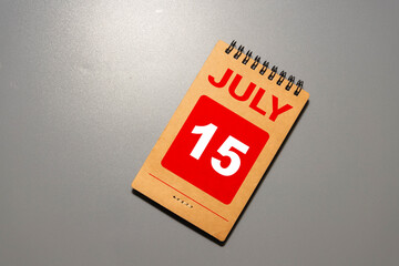 July 15th. Image of july 15 wooden color calendar on white background.