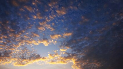 the afternoon sky is clear with yellow clouds highlighted by the sunlight