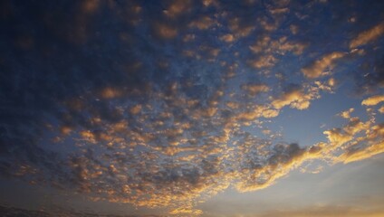 Beautiful cotton-like clouds are highlighted by the yellow afternoon sun, perfect for a background
