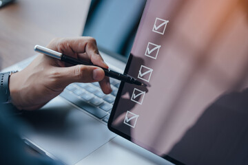Person using stylus to check items on a digital checklist on tablet