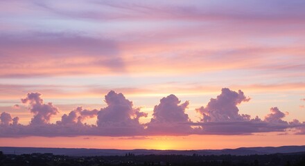 Dramatic Sunset Sky with Clouds Over City Horizon