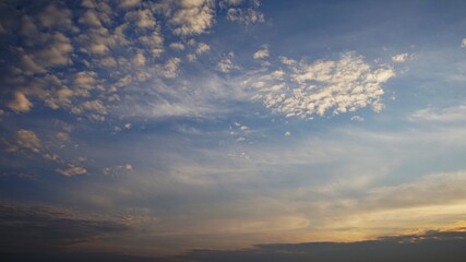 evening sky with yellow clouds, dramatic evening sky with lumpy yellow clouds