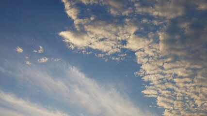 evening sky with yellow clouds, dramatic evening sky with lumpy yellow clouds