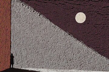 Shadow cast by a solitary figure against a textured wall during twilight in an urban setting