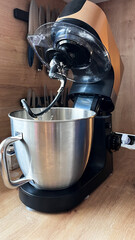 Food processor, that finished kneading dough for bread or cake. Elegant modern helper in home kitchen for baking and cooking. Home made process step by step