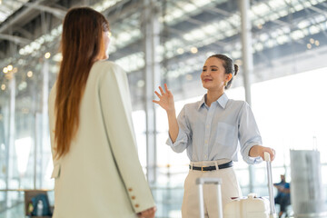 Happy female friends goodbye before travel flight, hello, best friend travel moment in airport lounge, influencer lifestyle, emotional farewell at terminal gate, female traveler connection