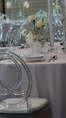 Wedding table. Plates. Flowers 