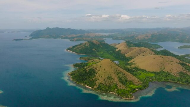Island surrounded by blue sea. Tropical Island with mountain valley. Lajala, Coron. Palawan. Philippines.