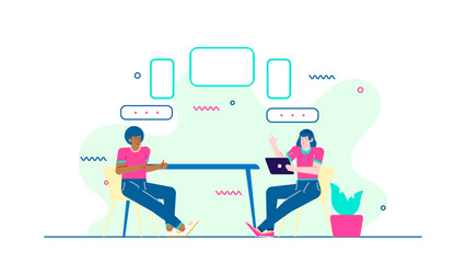 Two people discussing project at a table with laptops. Suitable for business meetings, teamwork, collaboration, tech projects, and freelancing concepts.