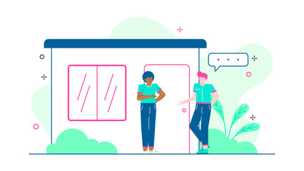 Two people talking outside a building surrounded by plants. Suitable for business discussions, outdoor meetings, or networking concepts.
