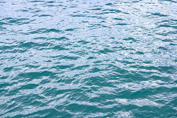 Ocean water surface. Water texture. Sea surface. Blue turquoise sea water background. Background of aqua sea water surface.