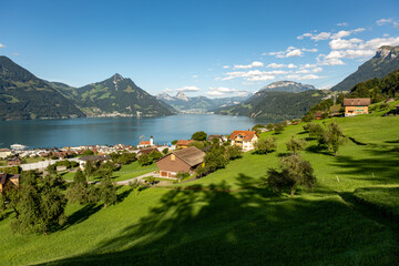 Scenic landscape. Swiss alps and lake landscape. Switzerland landscape. Swiss mountains and lake. Idyllic scenery in the Alps with fresh green meadows. National Park. Hiking and traveling.