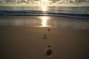 Sunset background. Sea with sky clouds reflection in water for background. Calm sea wallpaper background. Horizon over the water. Ocean background.