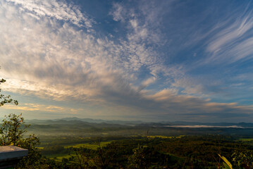 Blue golden sky sunrise dramatic beautiful landscape mountain. Dawn sky gold dusk time cloudscape with sunlight. Dramatic sunset over mountain landscape. Beautiful landscape foggy hills twilight time