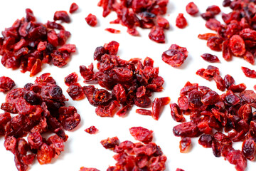 Dried cranberries piled on a white background